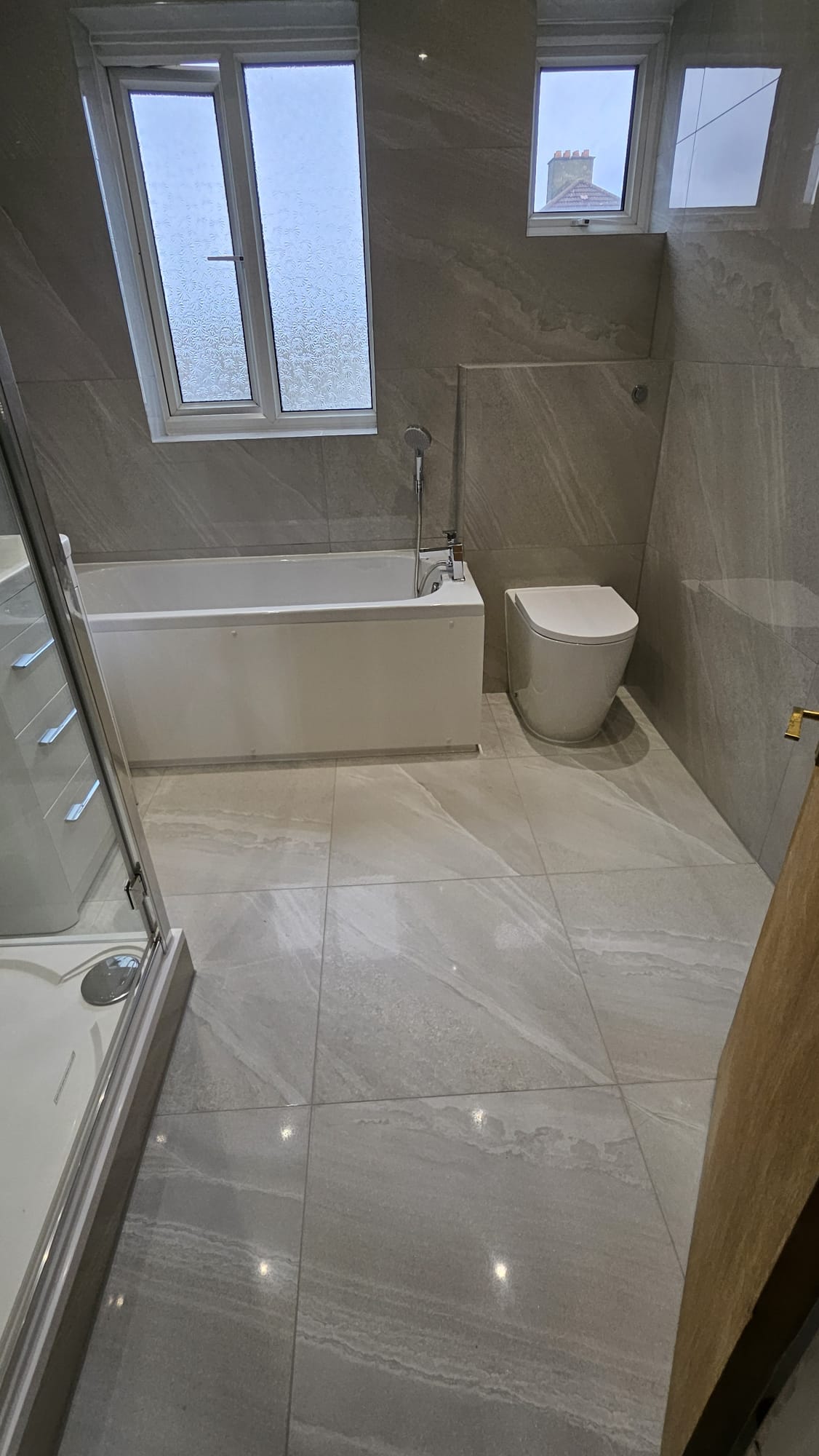 After: Modern grey tiled bathroom
